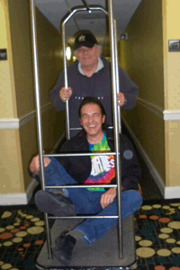 Jimmy Jay Pushes Fan & Friend Jim Marsella on  cart at The hotel before the cruise